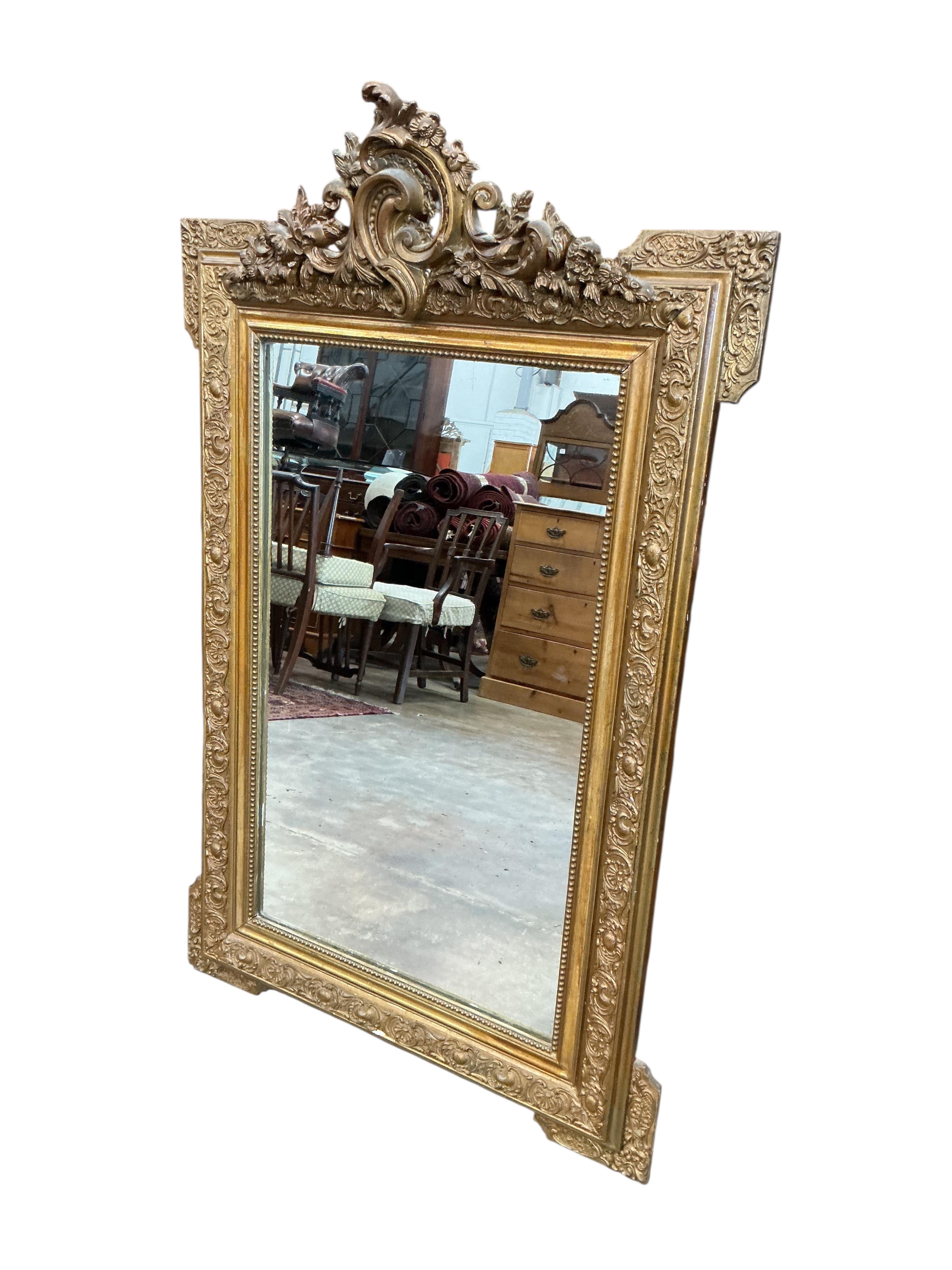 A late 19th century French giltwood and composition wall mirror, later painted, width 78cm, height 124cm